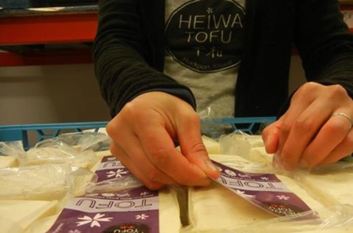 Maho labels by hand.  Up to 240 labels per hour (if Jeff isn't flirting with her).